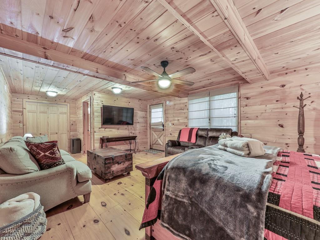 189 Smith Hill Road Blue Ridge, GA 30513 - Photo 26 of 29 a living room with furniture and a flat screen tv