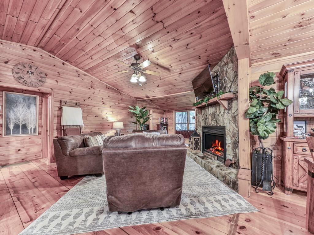 189 Smith Hill Road Blue Ridge, GA 30513 - Photo 6 of 29 a living room with furniture and a fireplace