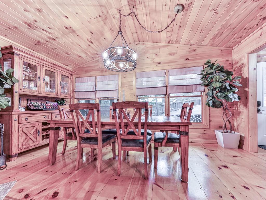 189 Smith Hill Road Blue Ridge, GA 30513 - Photo 8 of 29 a view of a dining room with furniture window and wooden floor