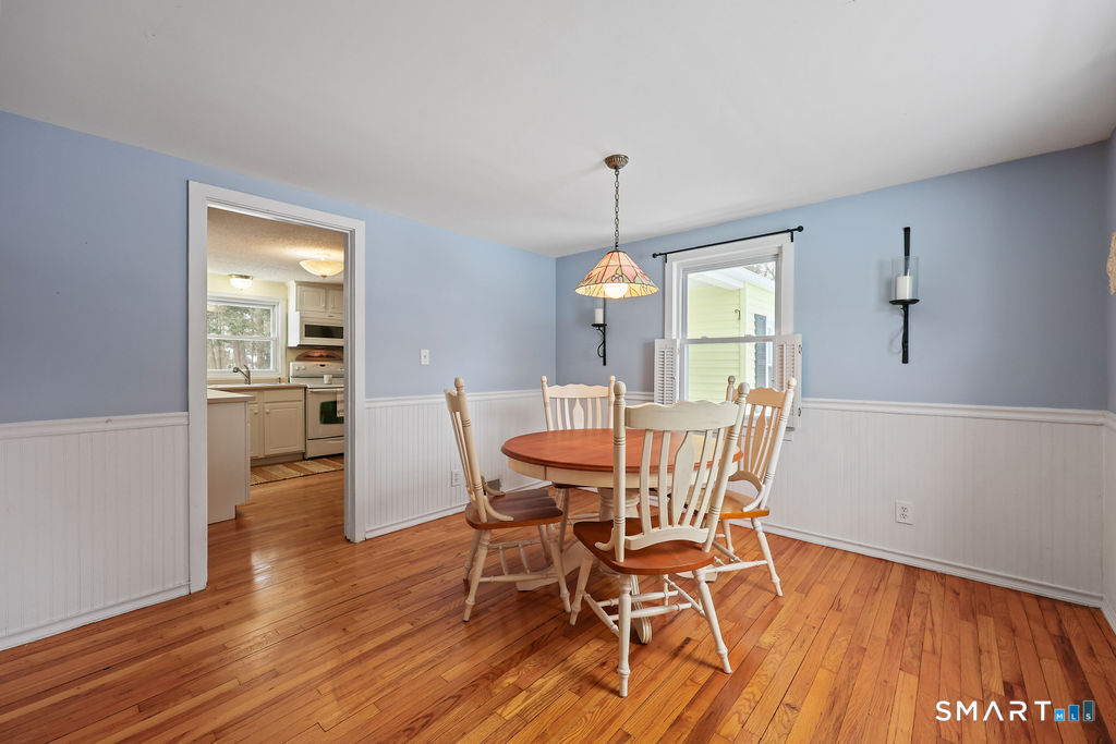 9 Barry Lane Simsbury, CT 06070 - Photo 11 of 28 a view of a dining room with furniture window and wooden floor