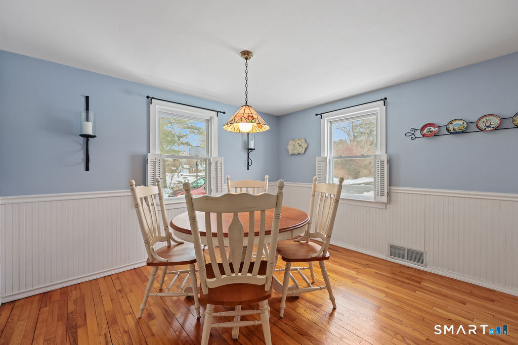 9 Barry Lane Simsbury, CT 06070 - Photo 12 of 28 a view of a dining room with furniture window and wooden floor