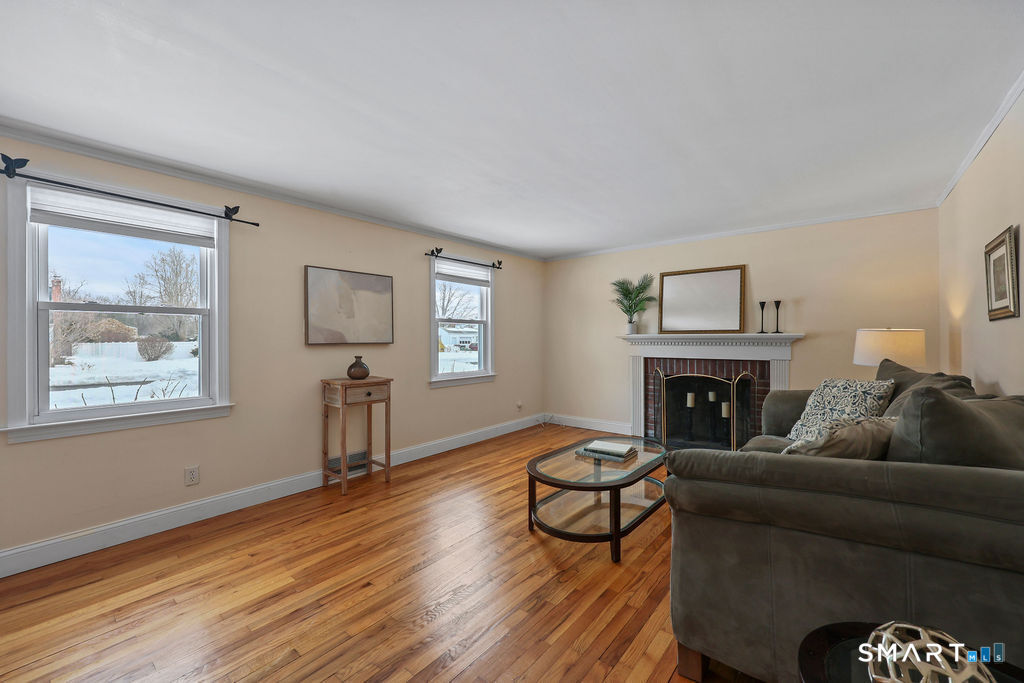 9 Barry Lane Simsbury, CT 06070 - Photo 14 of 28 a living room with furniture and a fireplace