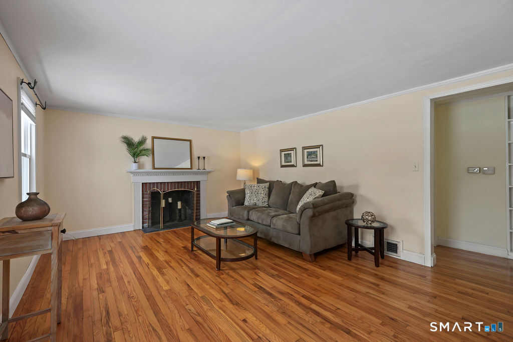 9 Barry Lane Simsbury, CT 06070 - Photo 15 of 28 a living room with furniture and a fireplace