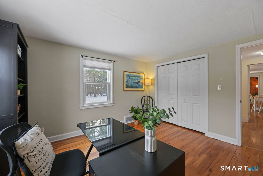 9 Barry Lane Simsbury, CT 06070 - Photo 17 of 28 a view of a workspace with furniture and a potted plant