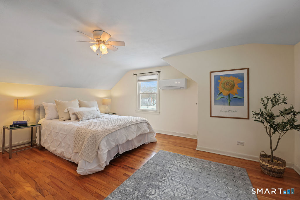 9 Barry Lane Simsbury, CT 06070 - Photo 20 of 28 a bedroom with a bed and a potted plant