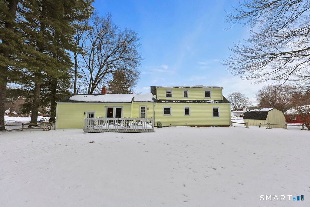 9 Barry Lane Simsbury, CT 06070 - Photo 3 of 28 a view of a house with a yard and garage