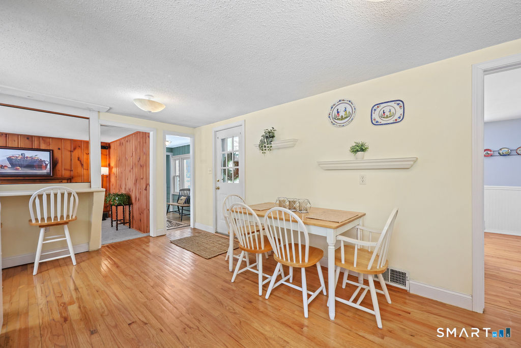 9 Barry Lane Simsbury, CT 06070 - Photo 8 of 28 a view of a dining room with furniture and wooden floor