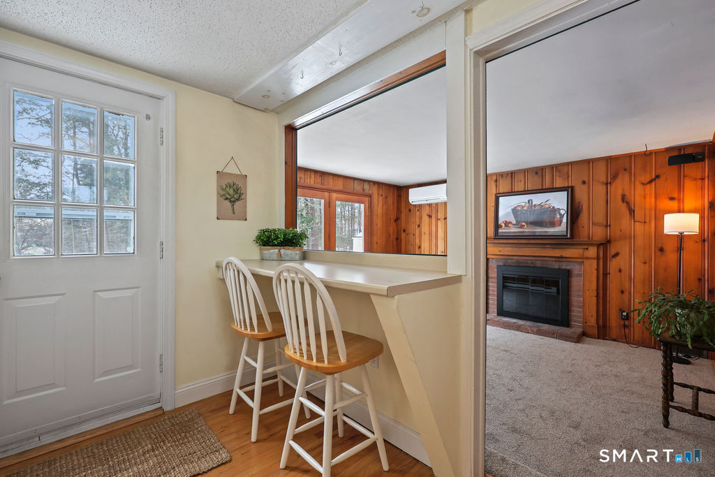 9 Barry Lane Simsbury, CT 06070 - Photo 9 of 28 a view of a livingroom with furniture and a fireplace