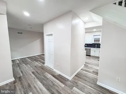 a view of a kitchen cabinets and wooden floor