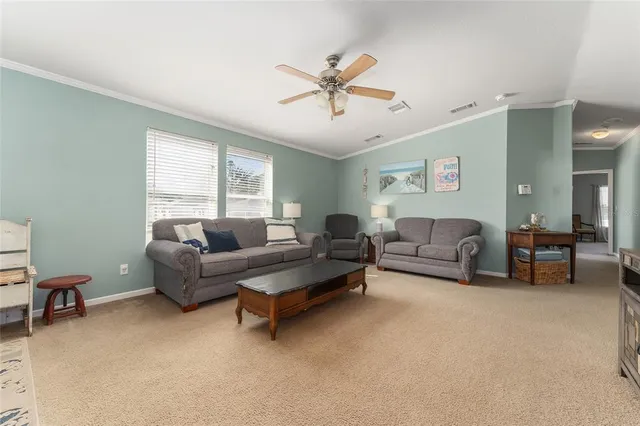 a living room with furniture and a window