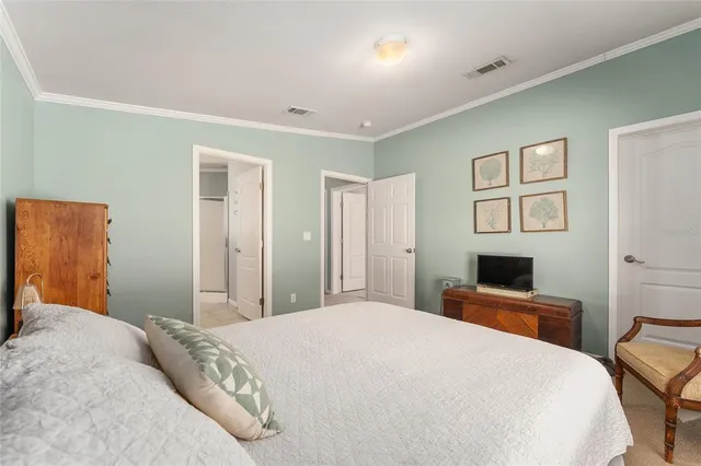 a bedroom with a large bed and furniture