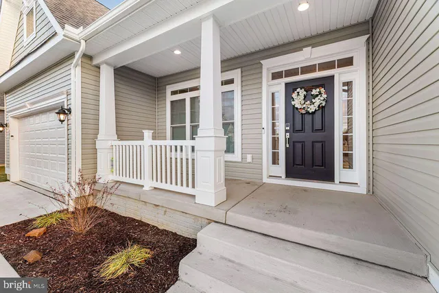 a front view of a house with a porch