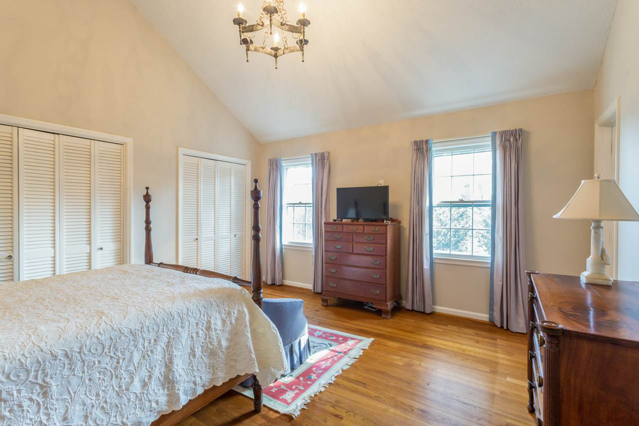 7616 Harps Mill Road Raleigh, NC 27615 - Photo 11 of 24 Soaring cathedral ceiling and beautiful/original light fixture. Master Suite
