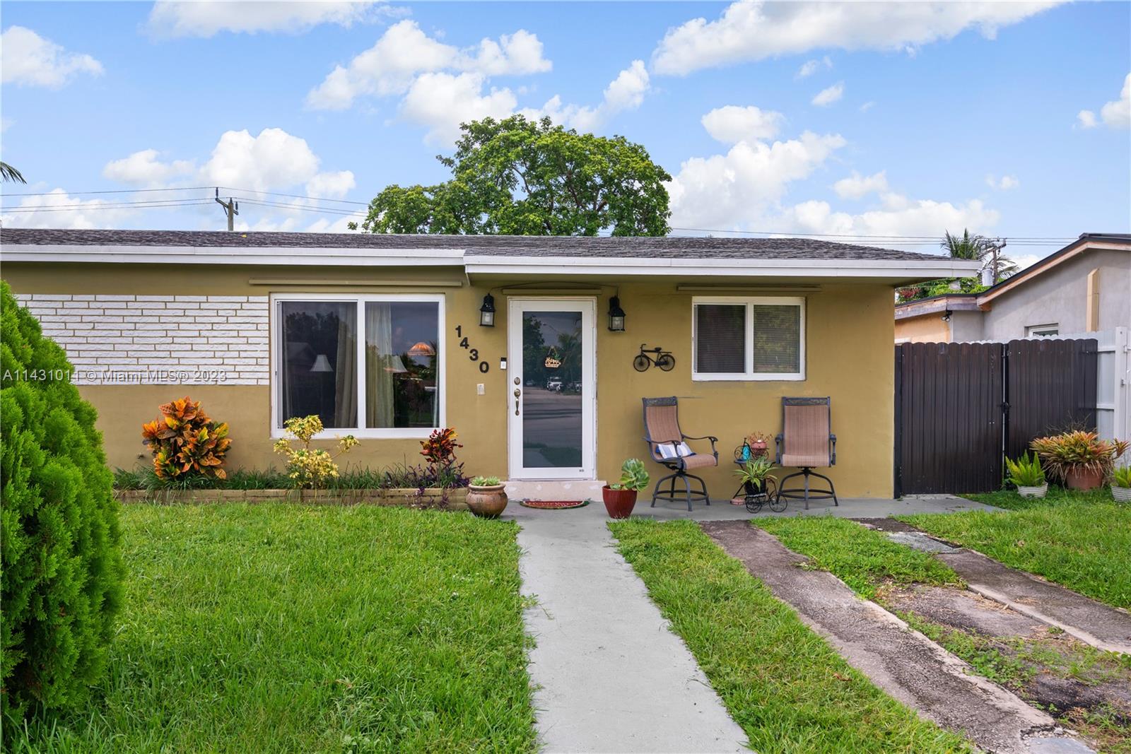 Hialeah Hialeah, FL 33012 - Photo 1 of 40 a front view of a house with garden