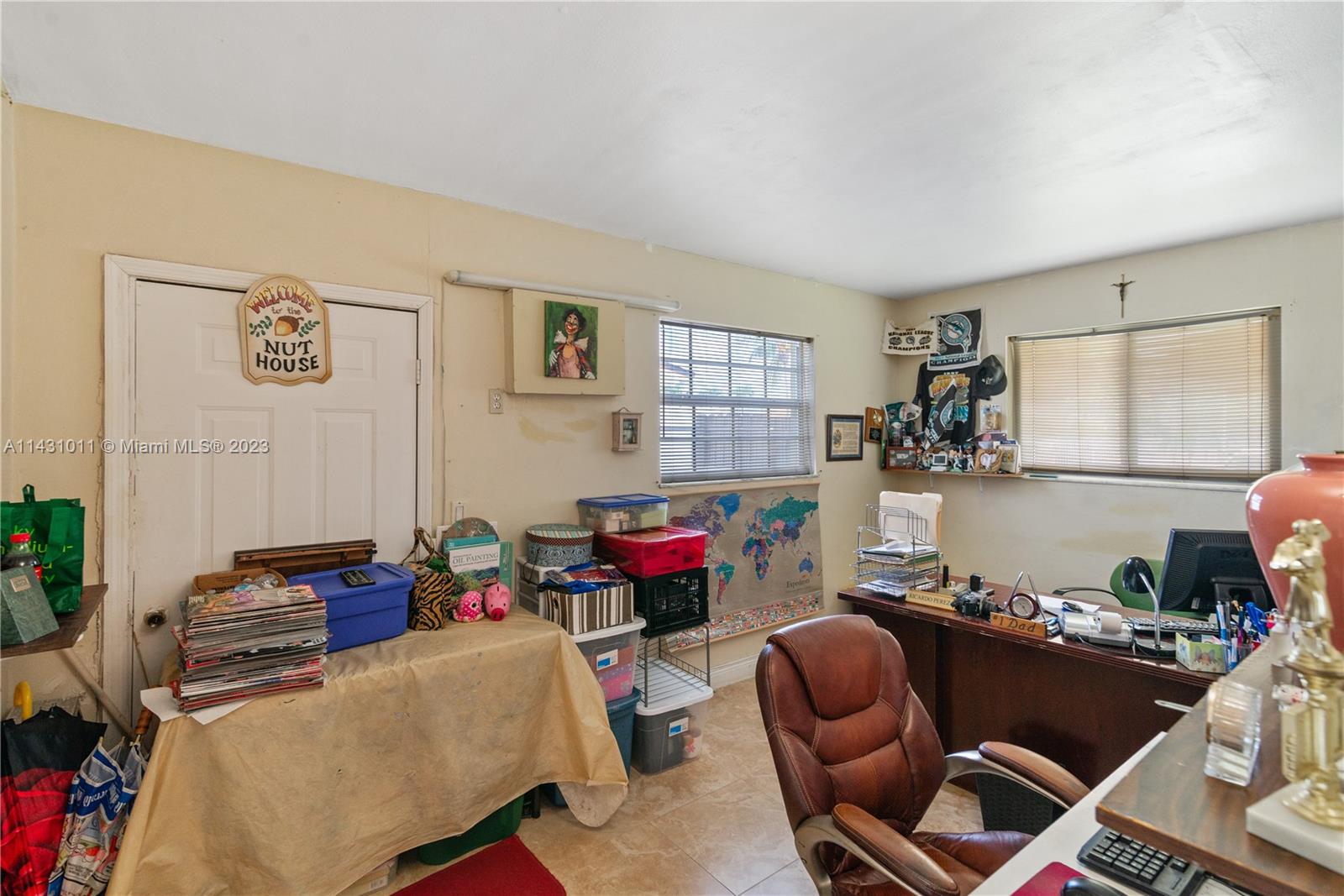 Hialeah Hialeah, FL 33012 - Photo 15 of 40 a room with furniture a rug and a window