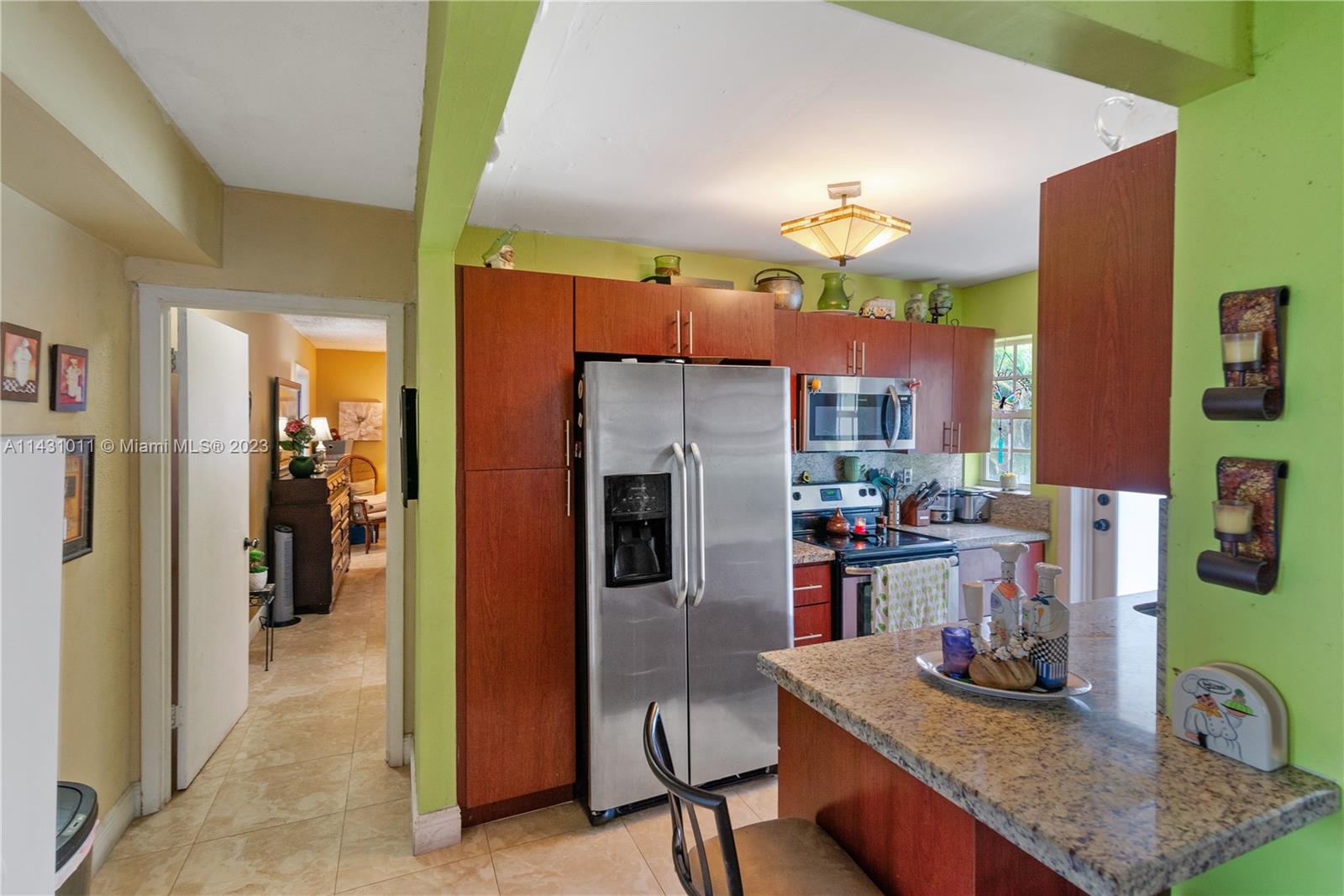 Hialeah Hialeah, FL 33012 - Photo 16 of 40 a kitchen with refrigerator and cabinets