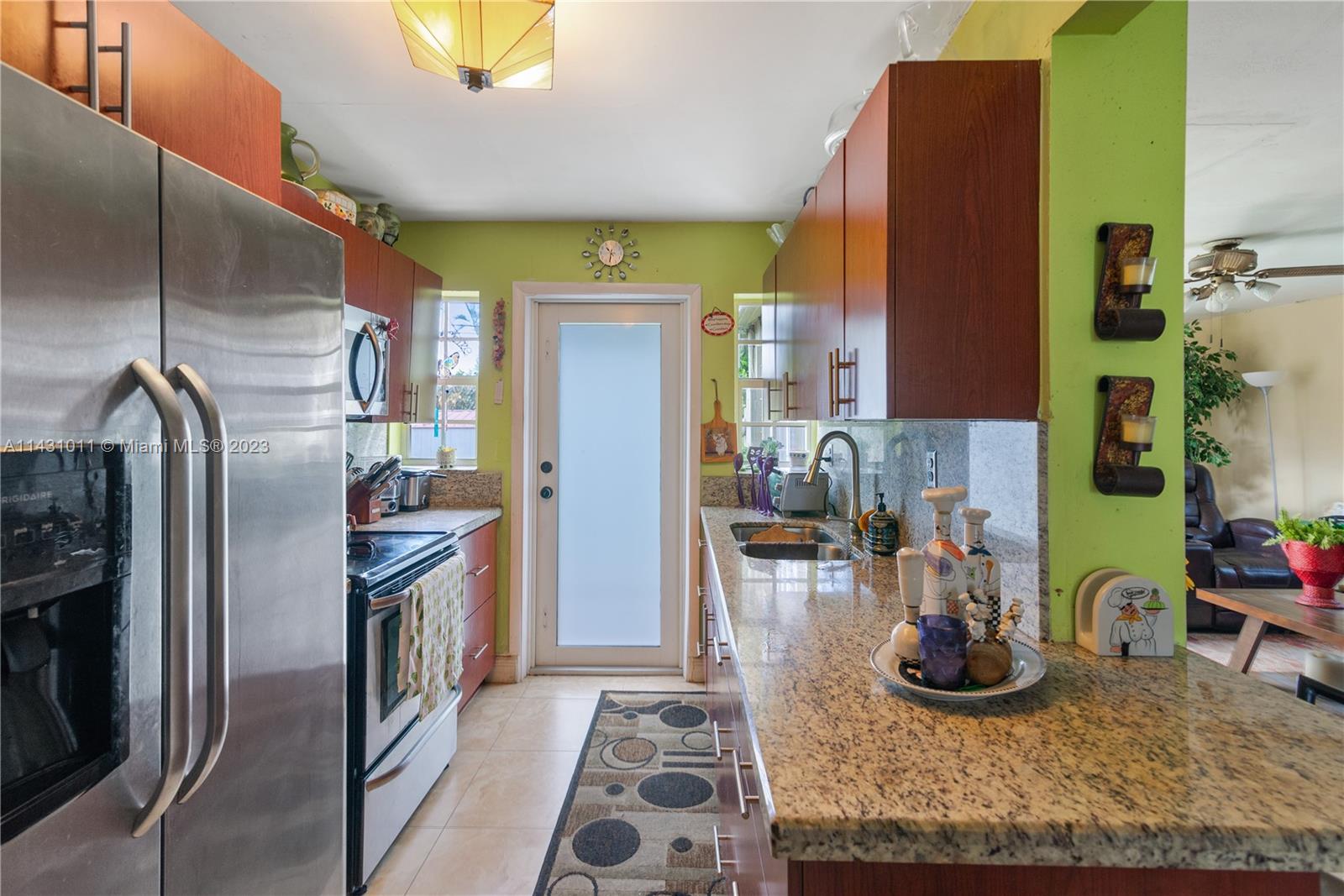 Hialeah Hialeah, FL 33012 - Photo 17 of 40 a kitchen with refrigerator and cabinets