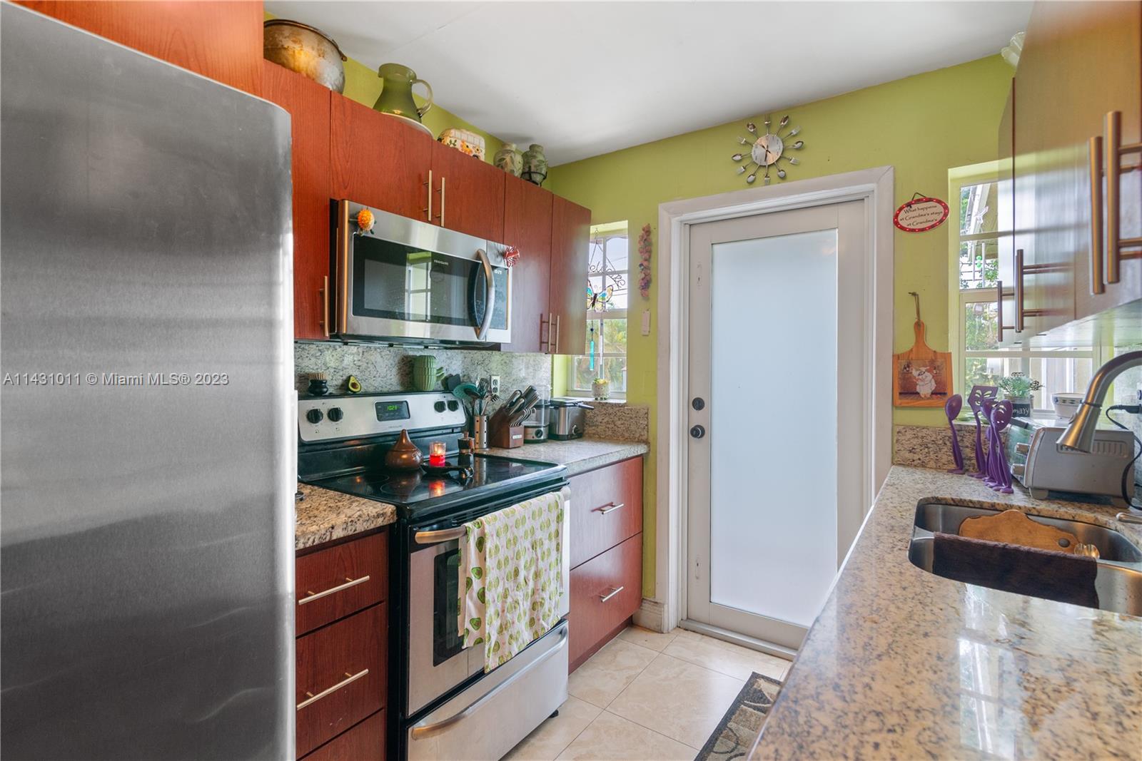 Hialeah Hialeah, FL 33012 - Photo 18 of 40 a kitchen with stainless steel appliances granite countertop a stove and a sink