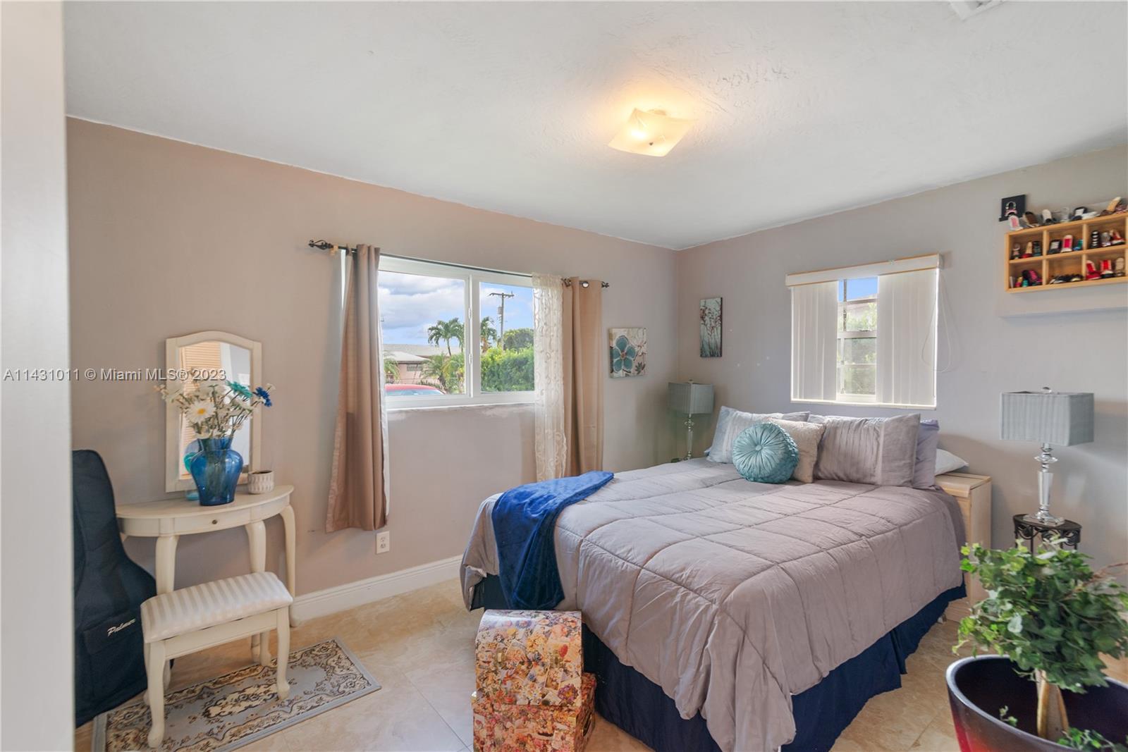 Hialeah Hialeah, FL 33012 - Photo 21 of 40 a bedroom with a bed and window