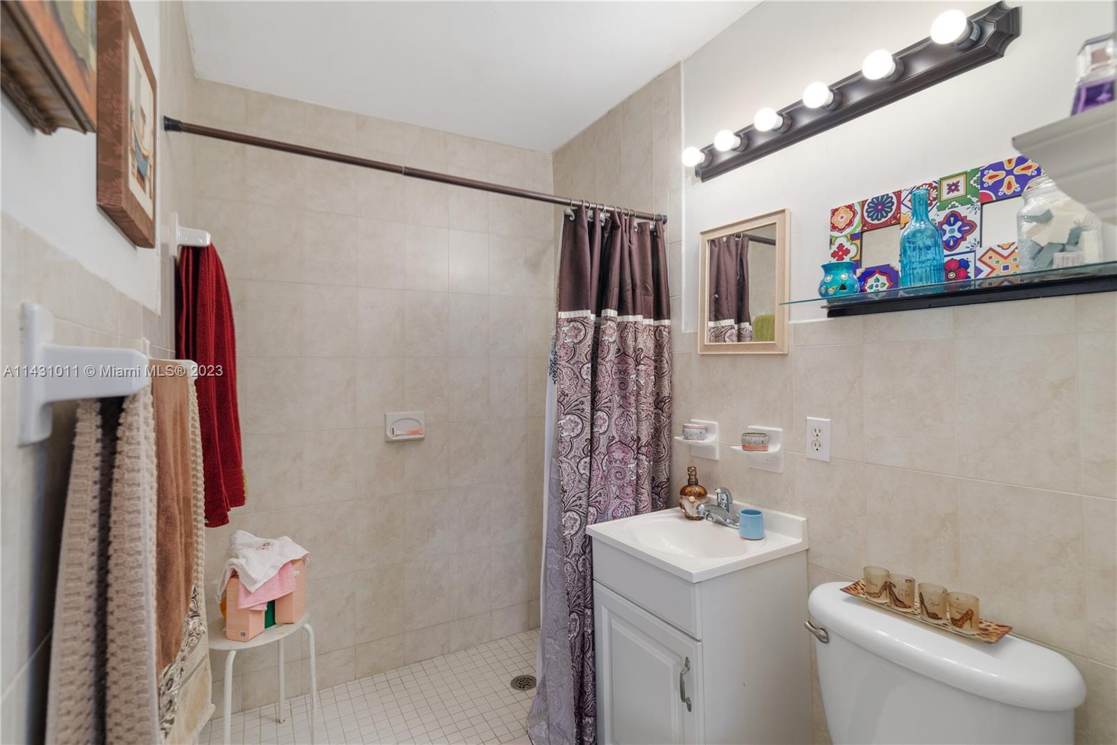 Hialeah Hialeah, FL 33012 - Photo 22 of 40 a bathroom with a sink and a mirror