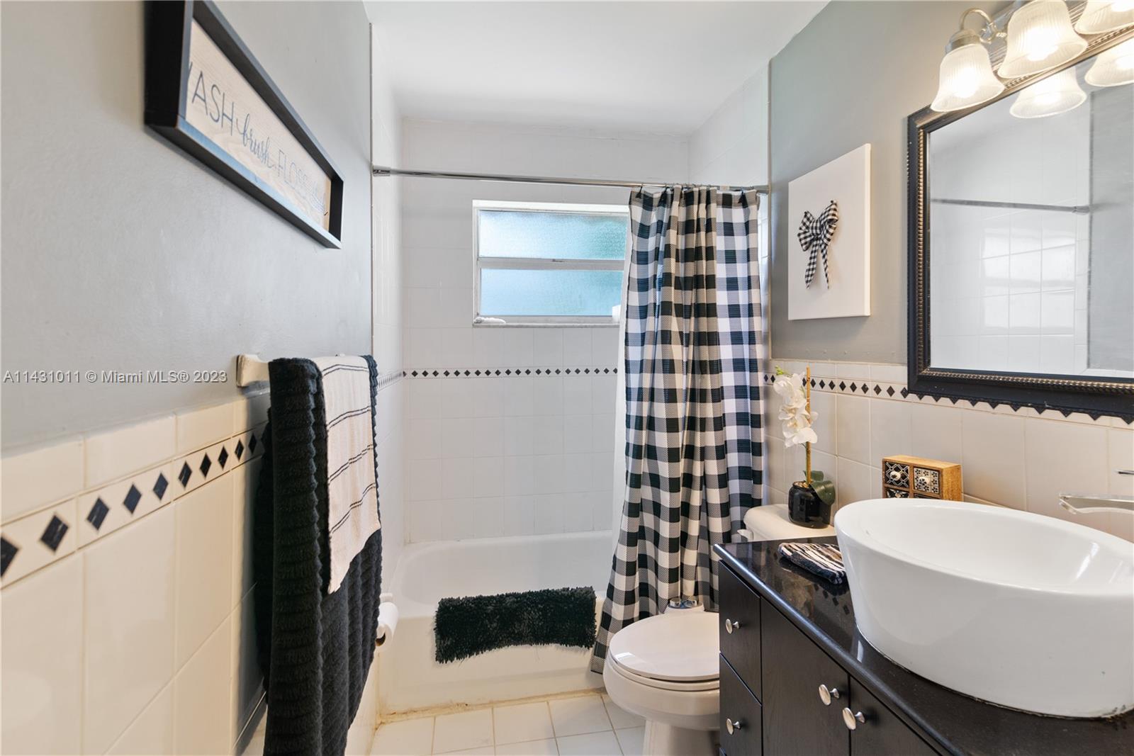 Hialeah Hialeah, FL 33012 - Photo 25 of 40 a bathroom with a sink toilet and shower