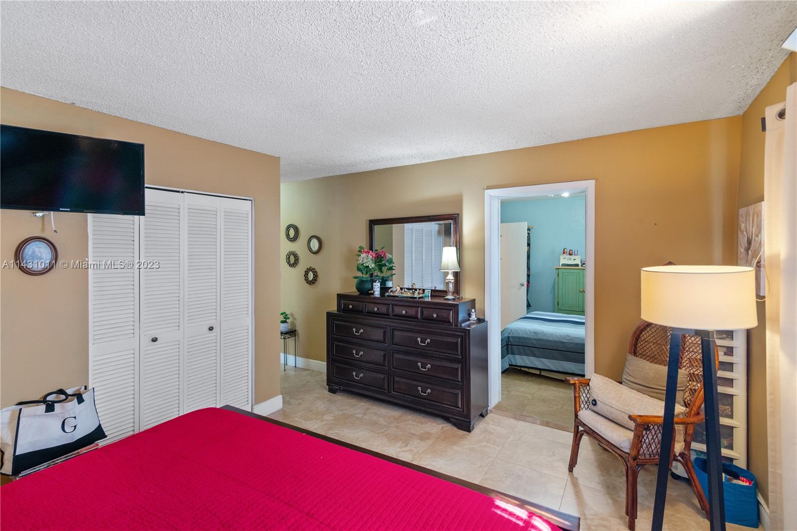 Hialeah Hialeah, FL 33012 - Photo 27 of 40 a bedroom with a bed and a view of bathroom