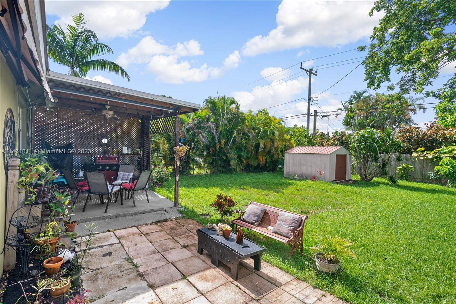 Hialeah Hialeah, FL 33012 - Photo 28 of 40 a view of a chairs and table in a backyard