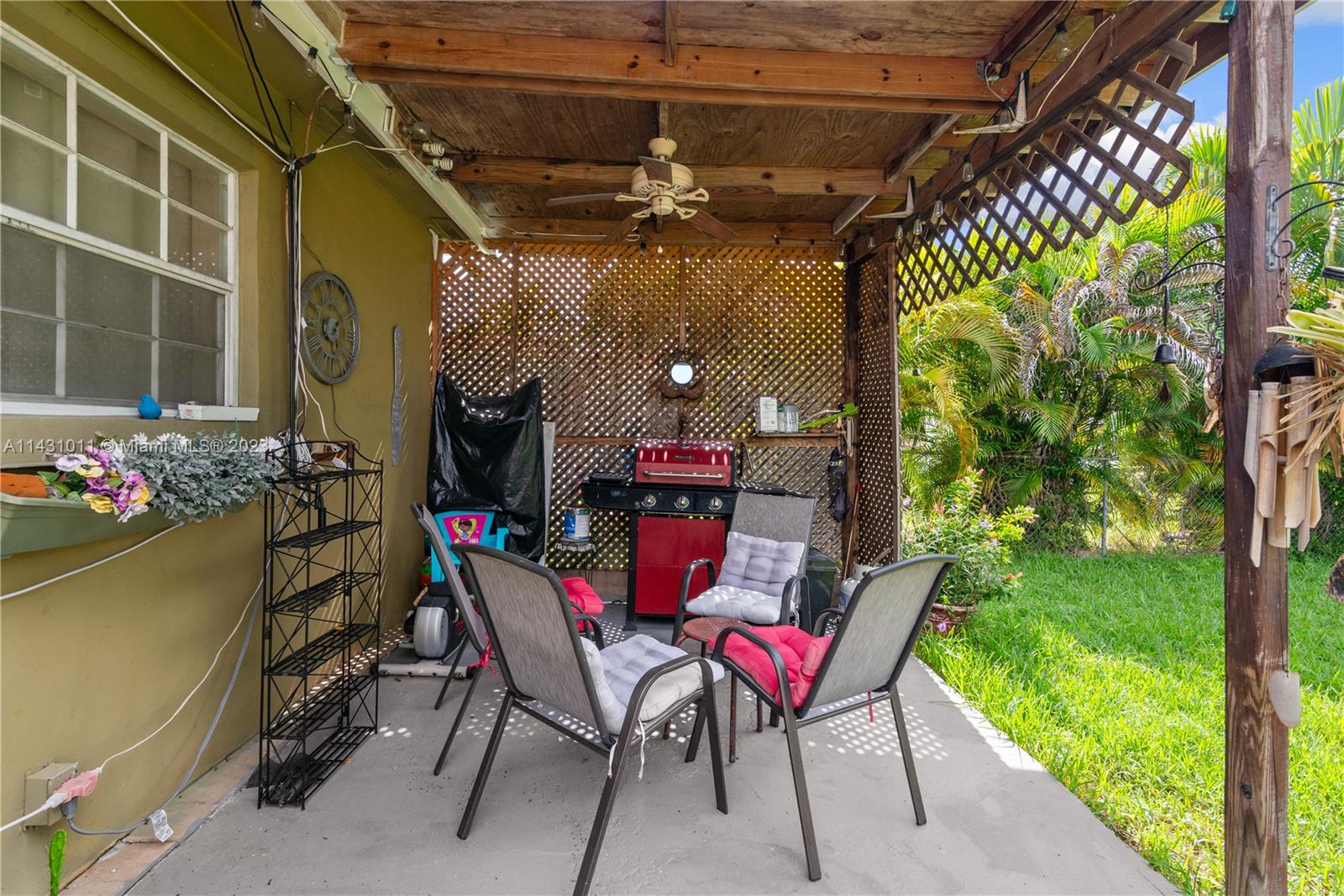 Hialeah Hialeah, FL 33012 - Photo 29 of 40 a view of a chairs and table in a patio