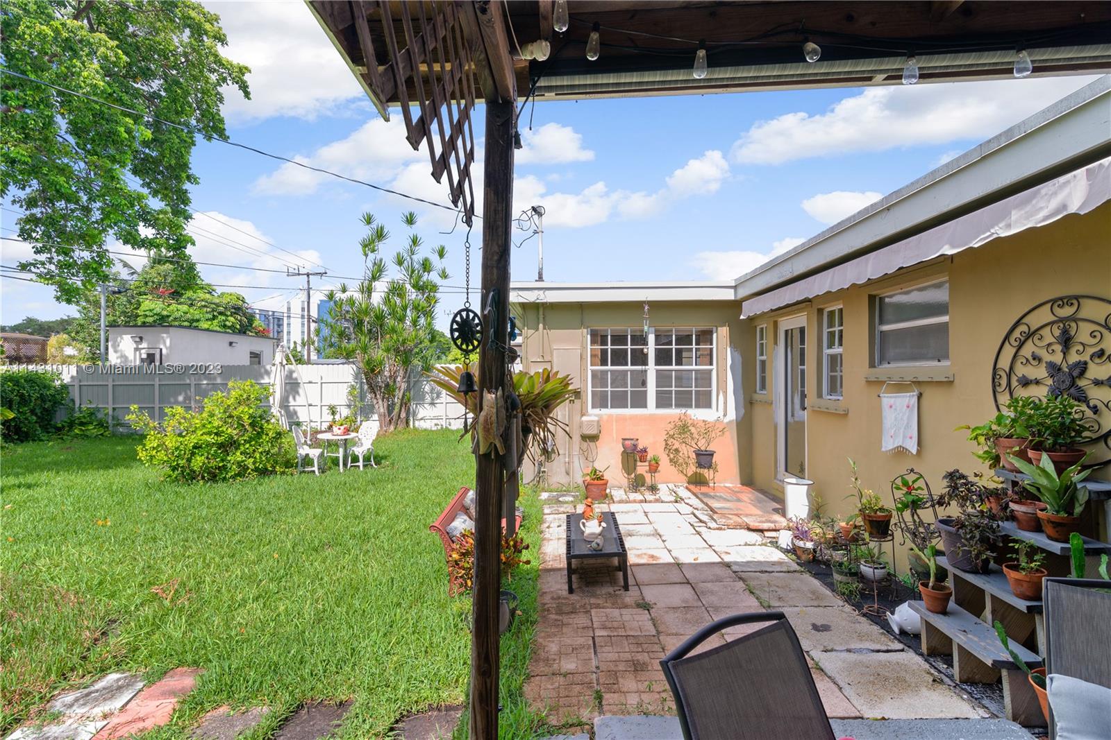 Hialeah Hialeah, FL 33012 - Photo 30 of 40 a front view of a house with garden