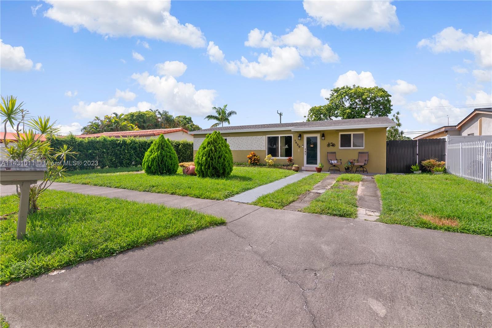 Hialeah Hialeah, FL 33012 - Photo 3 of 40 a view of house with a big yard and potted plants