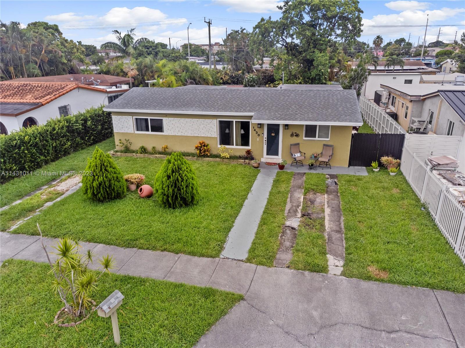 Hialeah Hialeah, FL 33012 - Photo 32 of 40 a aerial view of a house with a yard