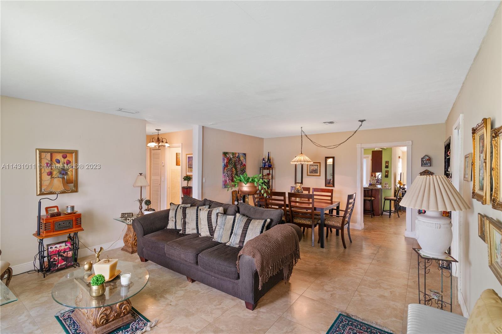 Hialeah Hialeah, FL 33012 - Photo 9 of 40 a living room with furniture and a dining table