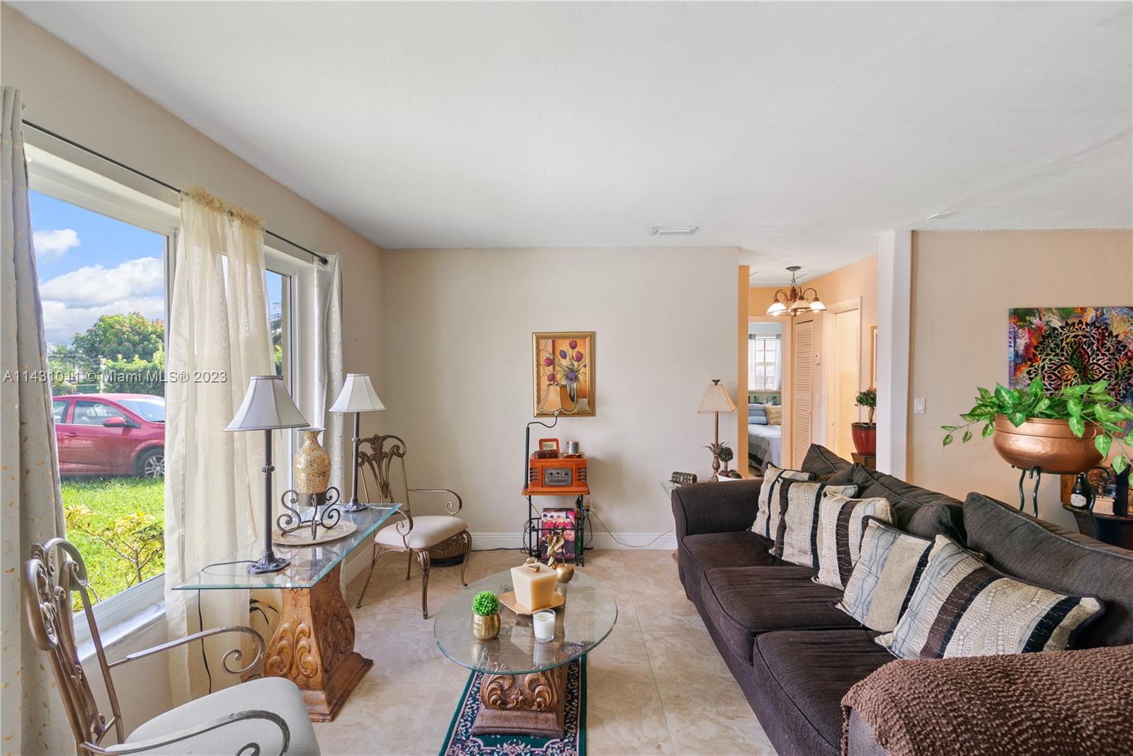 Hialeah Hialeah, FL 33012 - Photo 10 of 40 a living room with furniture fireplace and a large window