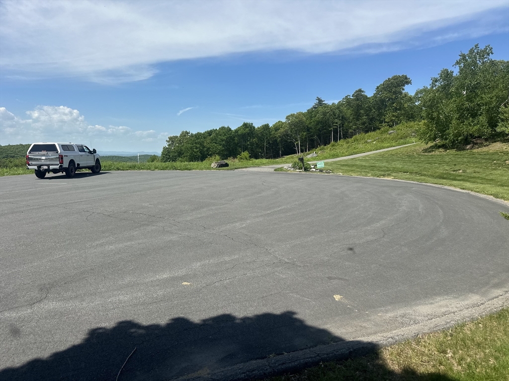 8 South Rdg Road Hampden, MA 01036 - Photo 14 of 15 a car driving down a road next to a yard