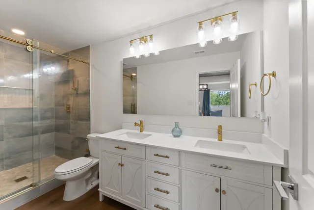 a kitchen with sink stove and cabinets