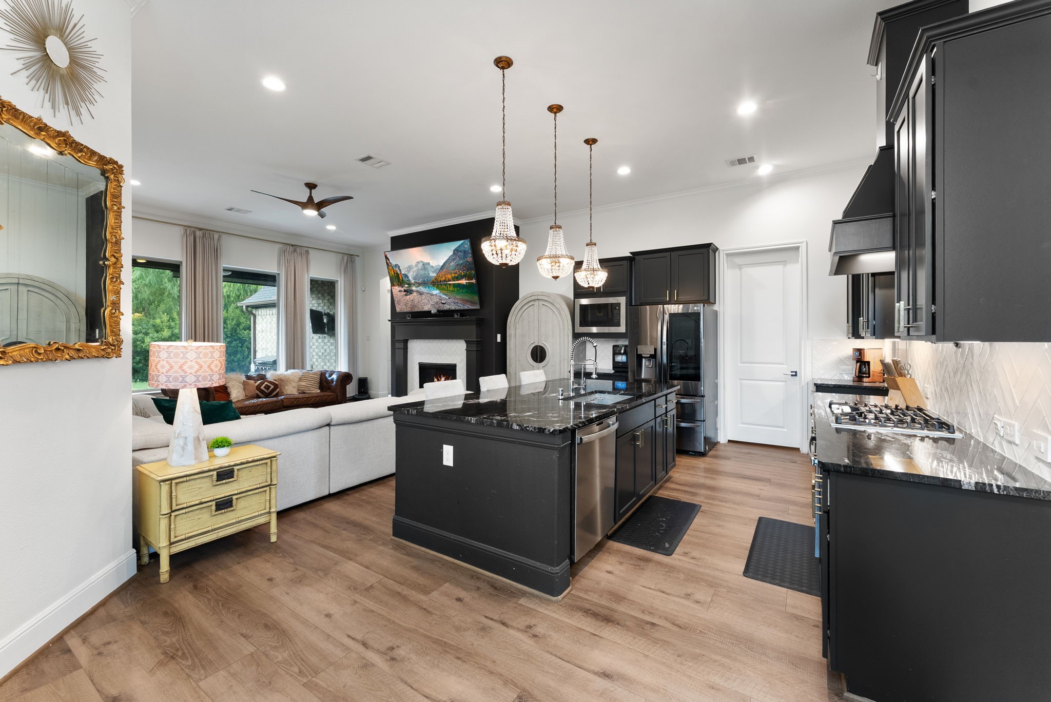 10082 Preserve Way Conroe, TX 77385 - Photo 17 of 47 Open kitchen with abundant cabinetry, tile backsplash, and pendant lighting.