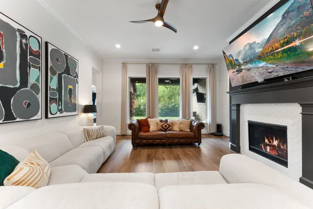 a white bath tub sitting in a bathroom next to a window