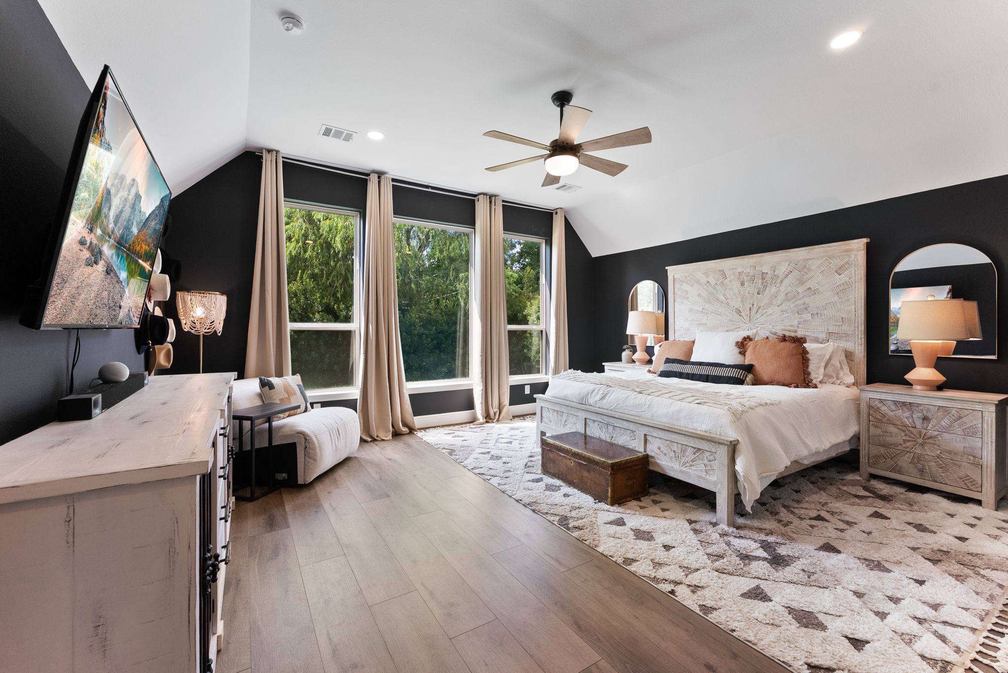 10082 Preserve Way Conroe, TX 77385 - Photo 24 of 47 Spacious primary suite with high ceilings, no carpet, and large windows overlooking the backyard.