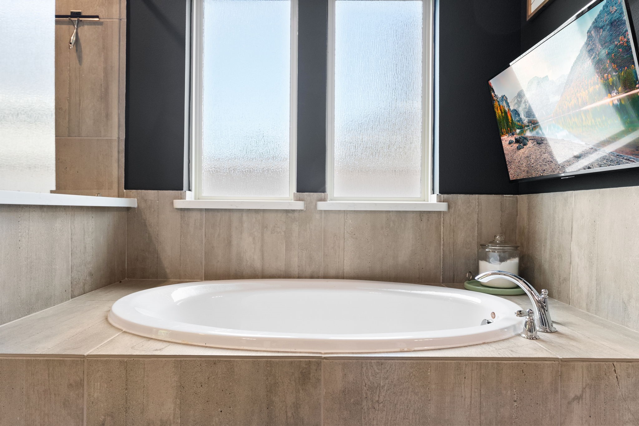 10082 Preserve Way Conroe, TX 77385 - Photo 30 of 47 a white bath tub sitting in a bathroom next to a window