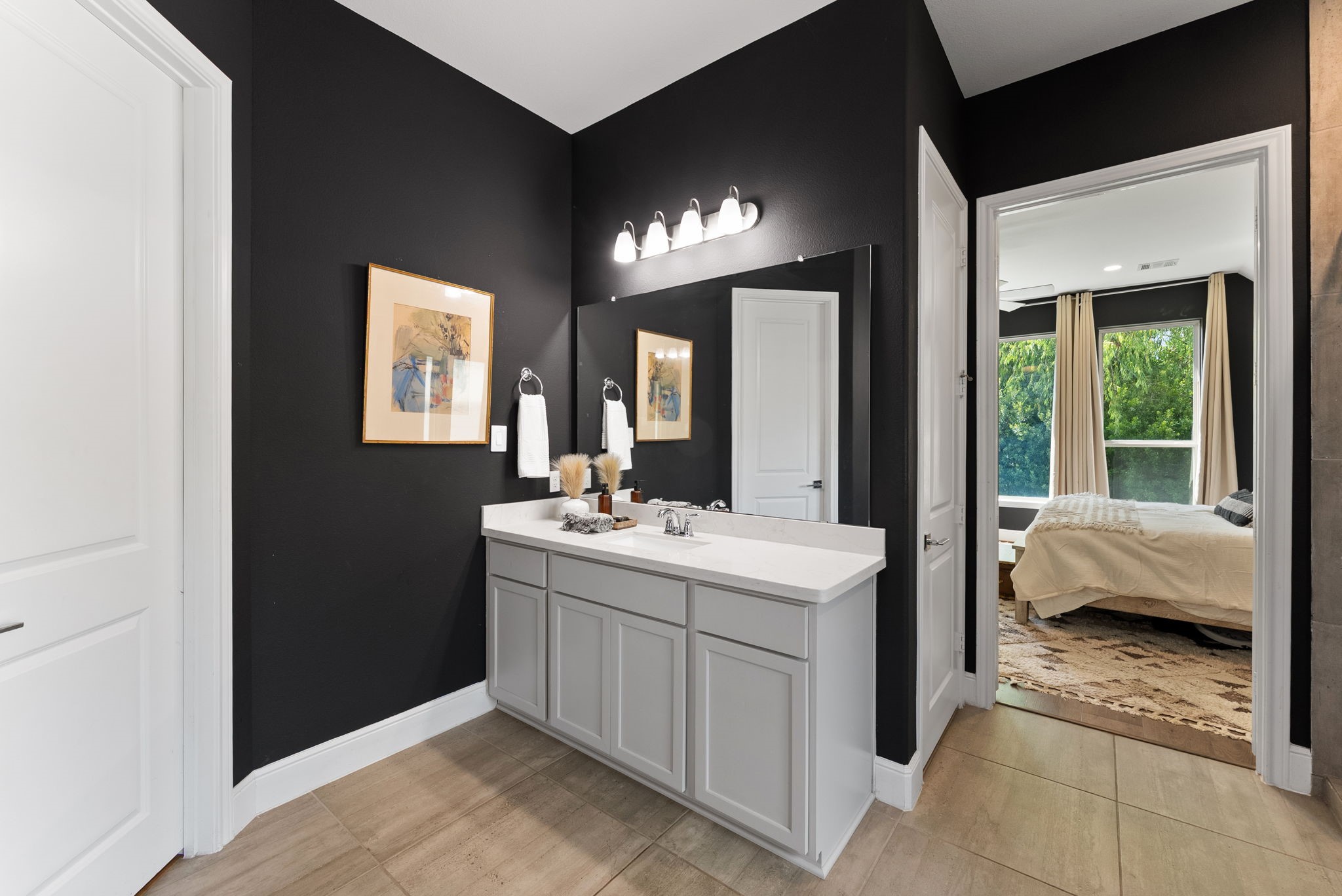 10082 Preserve Way Conroe, TX 77385 - Photo 31 of 47 a en suite bathroom with a sink and a mirror