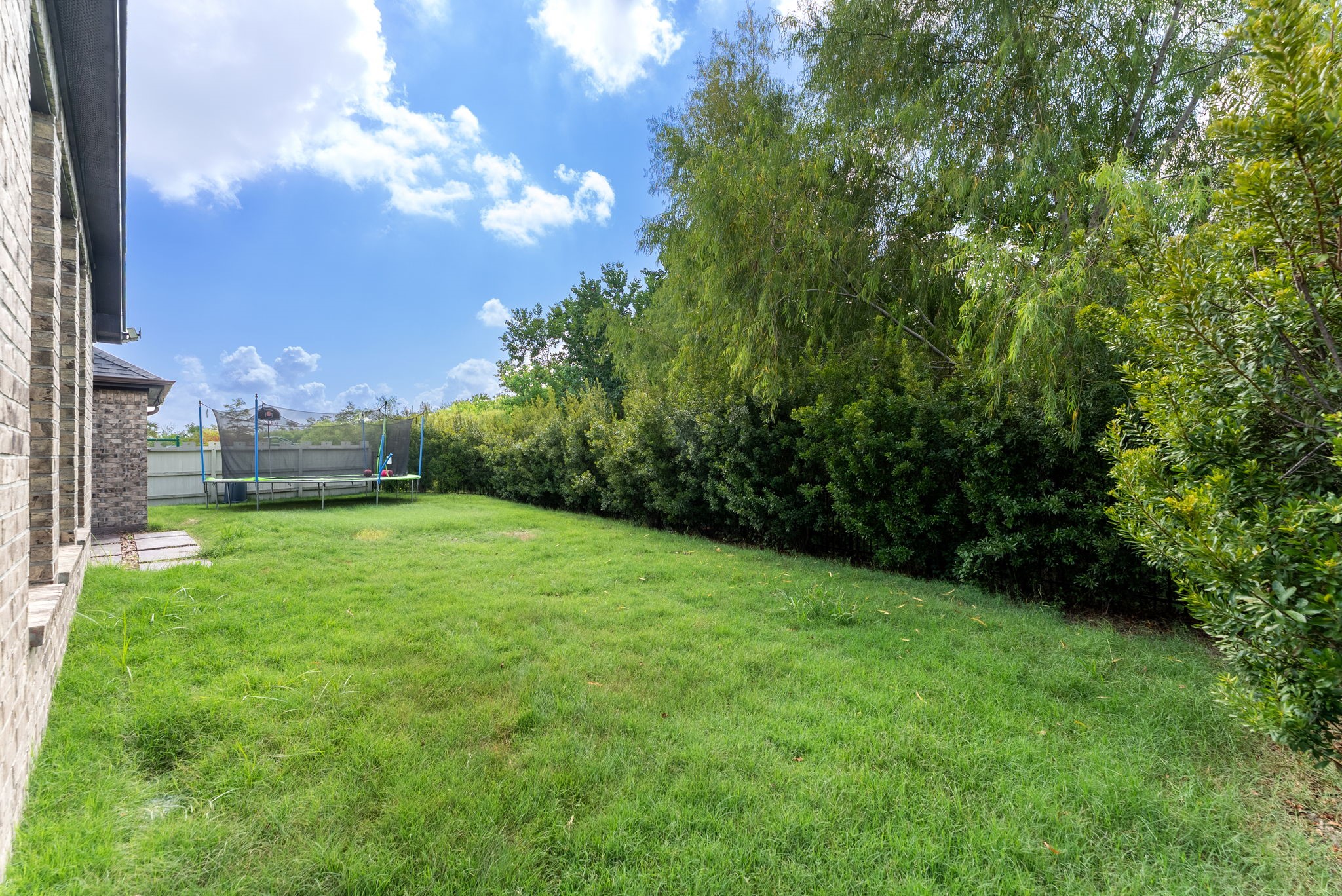 10082 Preserve Way Conroe, TX 77385 - Photo 38 of 47 a view of a grassy field with trees