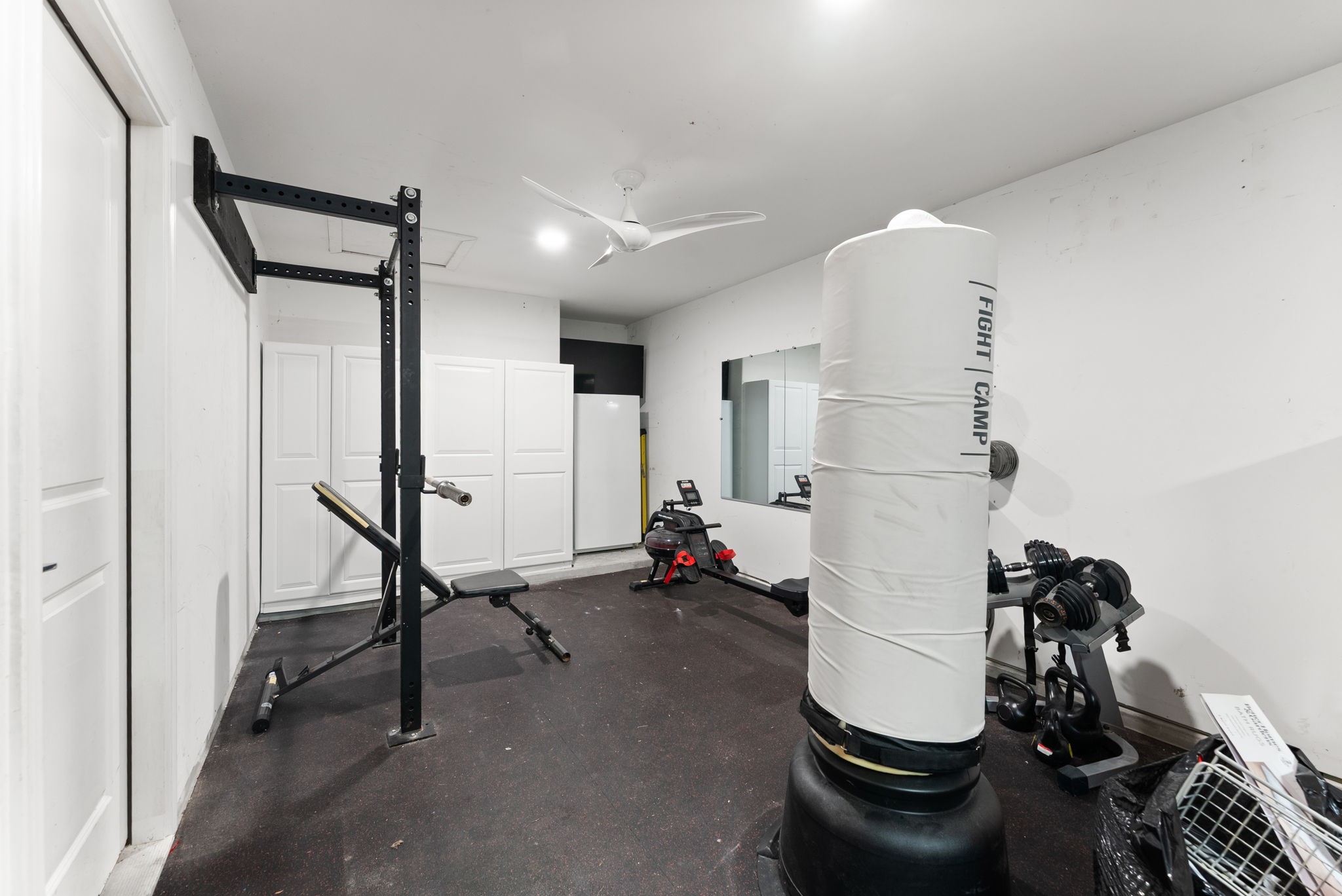 10082 Preserve Way Conroe, TX 77385 - Photo 42 of 47 Converted tandem third-car garage currently outfitted as a private home gym.