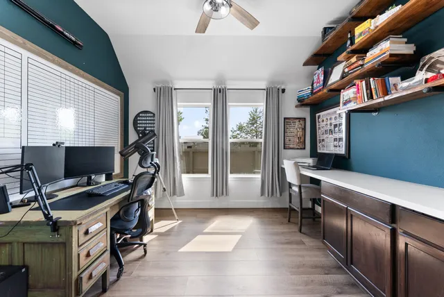 a workspace with furniture and a window