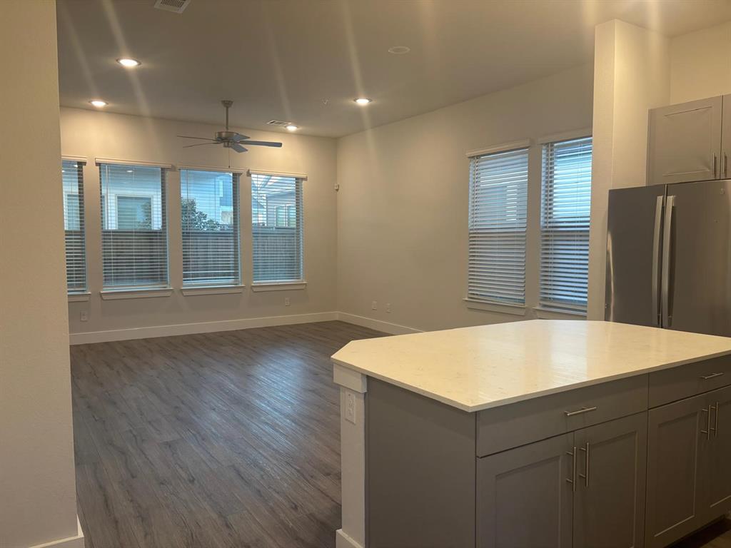 825 West Mayfield Road, Unit 224 Arlington, TX 76015 - Photo 2 of 25 a room with wooden floor and windows