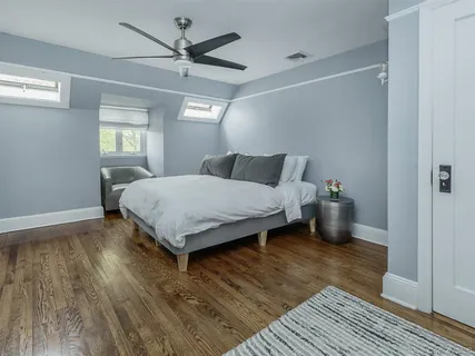 a bedroom with a bed and window