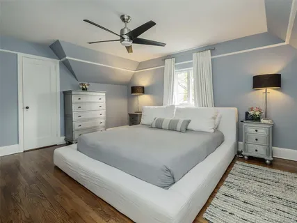 a large white bed in a white room