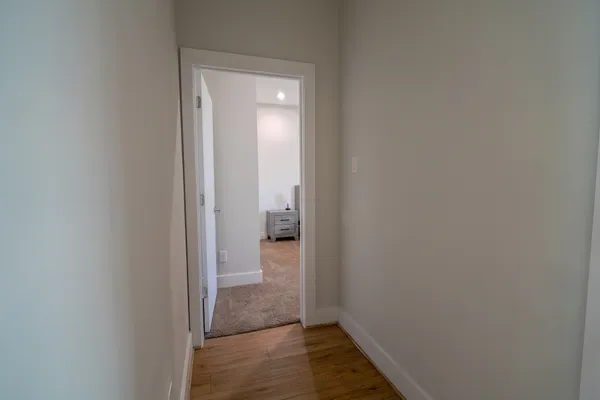 a view of a bathroom from a hallway
