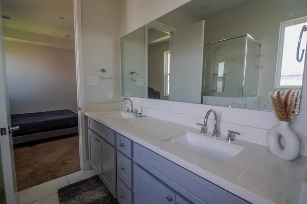 a bathroom with a sink and a mirror