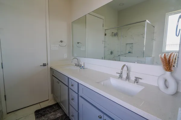 a bathroom with a sink and a mirror