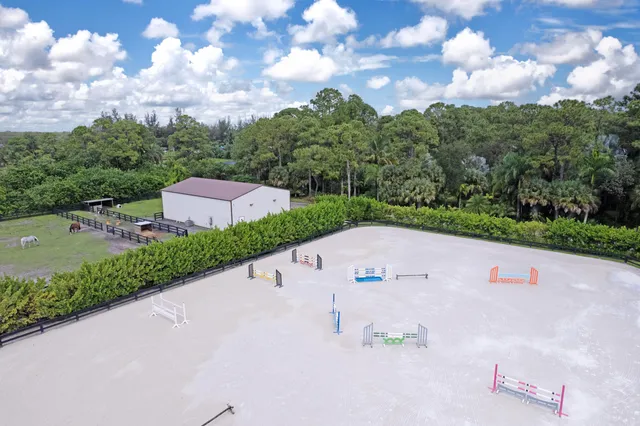 a view of a street with houses in the background